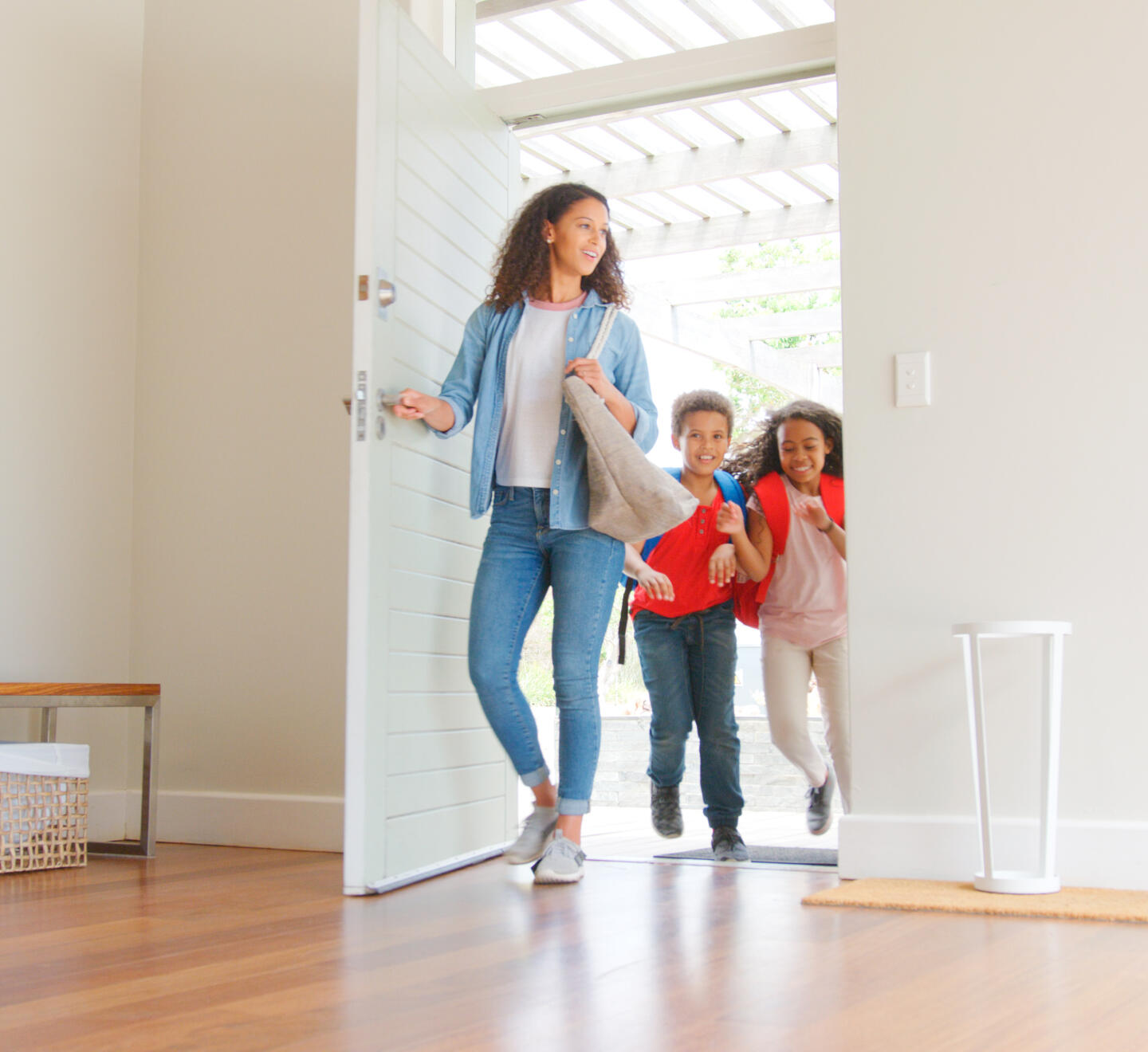 Happy family entering house