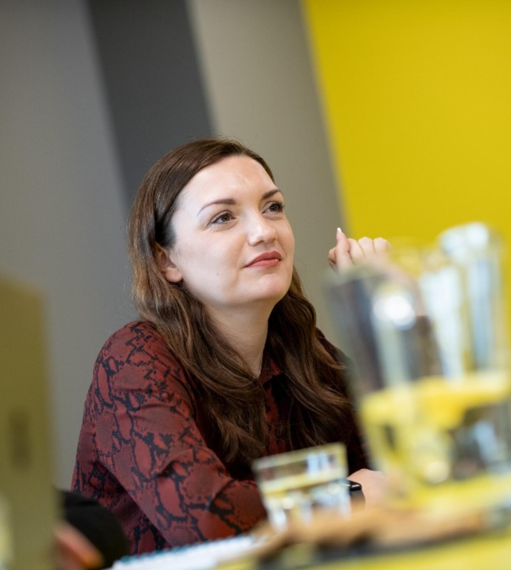 Lemon team member in a meeting discussing outsourced customer service