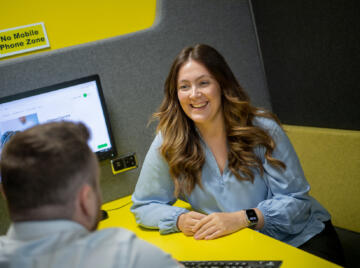 Smiling Lemon Contact Centre team member discussing call handling