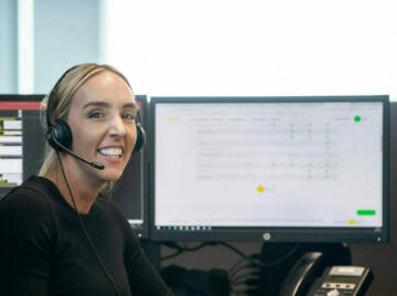 Ssmiling contact centre operator wearing headset