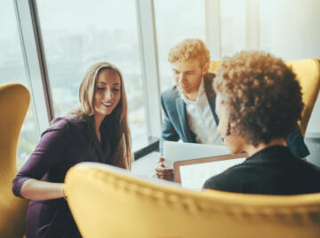 Professionals in a meeting discussing call handling