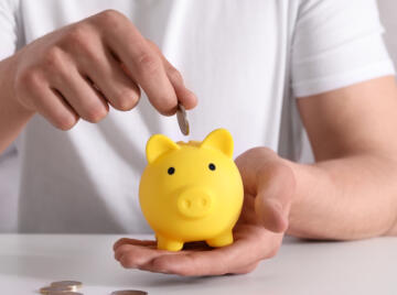 Yellow piggy bank for savings and pension
