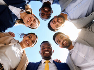 Unified Diverse Team Looking Down Group Collaboration and Success