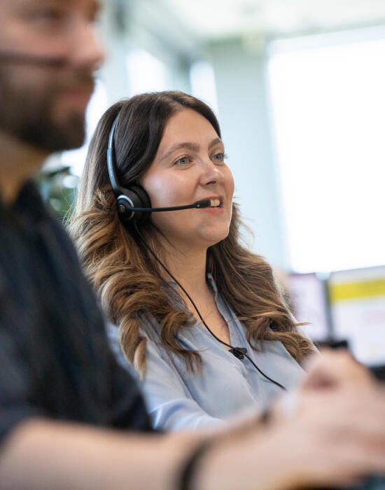 Male and female call centre operators at Lemon Contact Centre