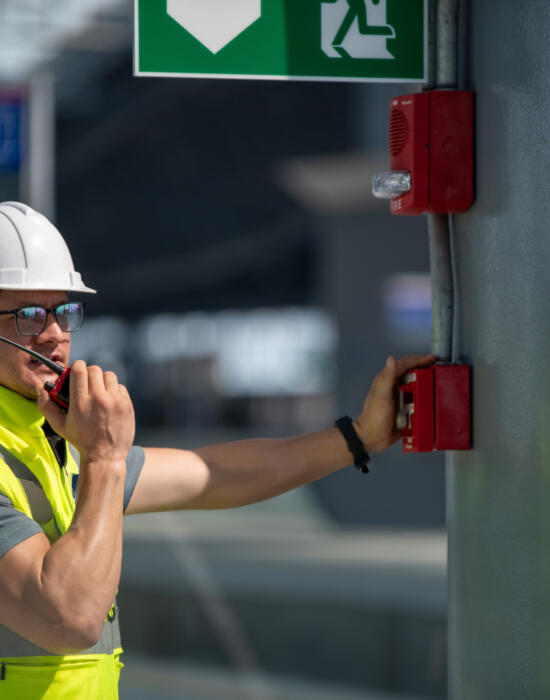 Engineer checking fire alarm