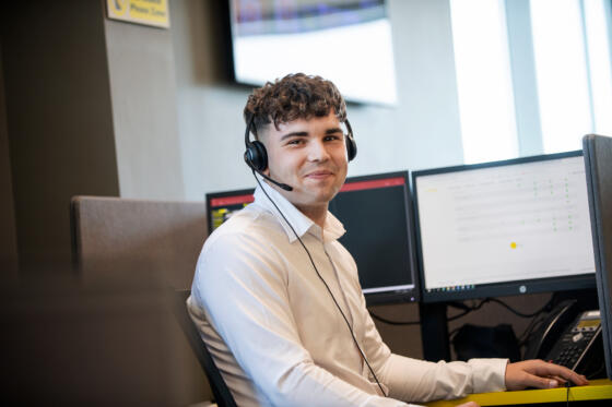 Male call centre operator wearing headset