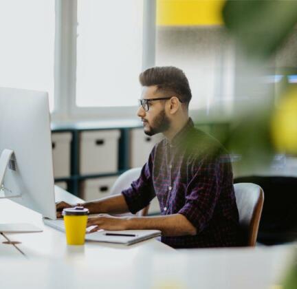 One of our friendly staff providing call answering assistance whilst looking at his computer.