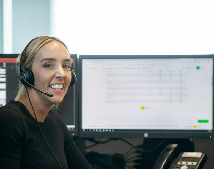 Ssmiling contact centre operator wearing headset