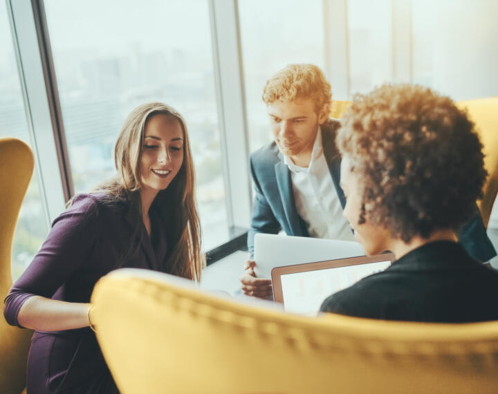 Professionals in a meeting discussing call handling