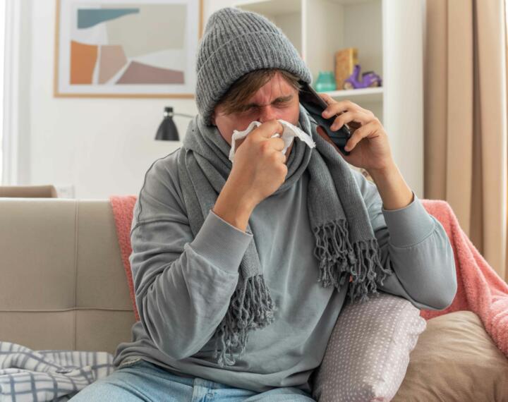 Person phoning to report a sickness absence