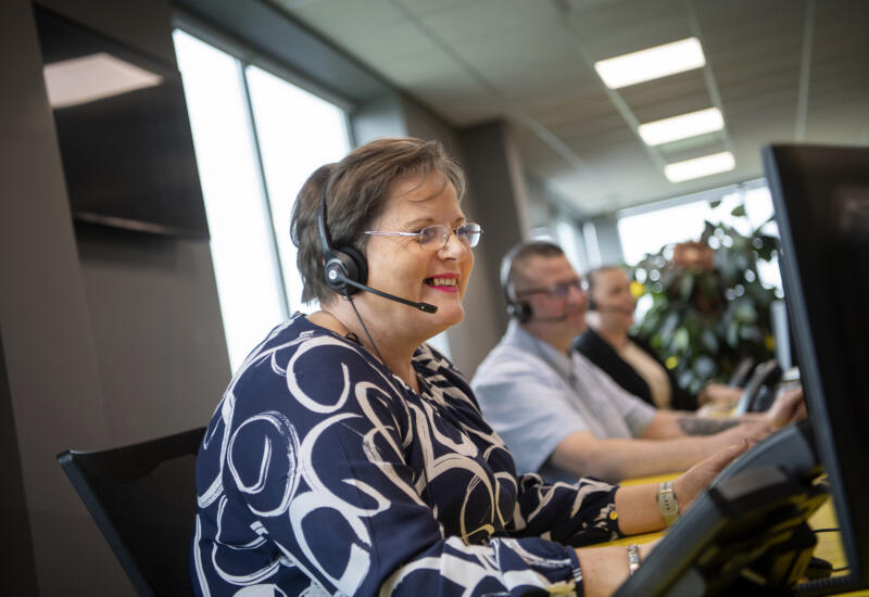 Lemon Contact Centre operator smiling whilst wearing headset