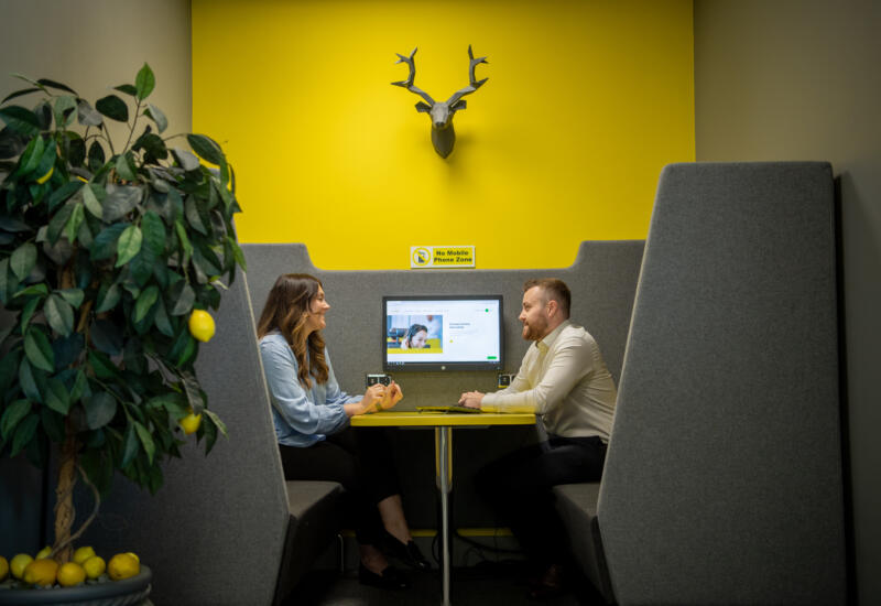 Male and female having a meeting at Lemon Contact Centre