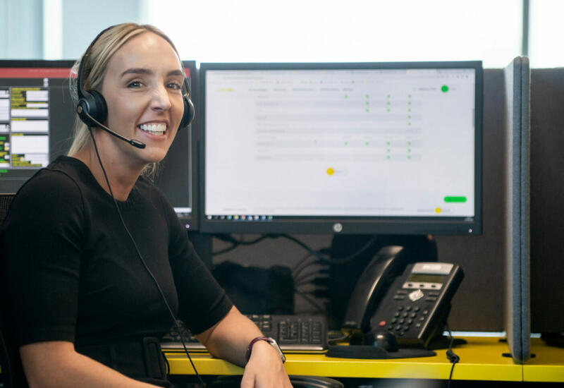 Lemon Contact Centre operator smiling looking at camera wearing heatset