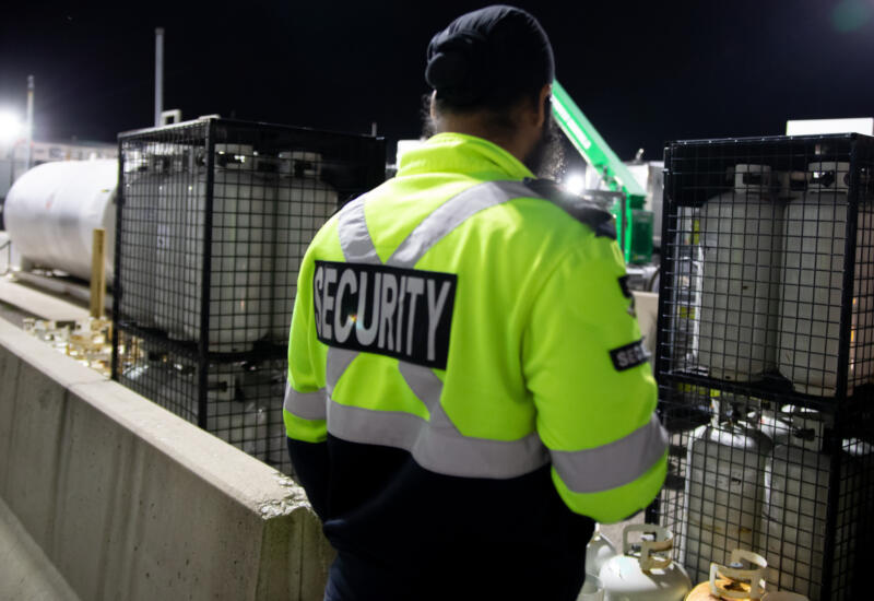 Security guard patrolling premises at night
