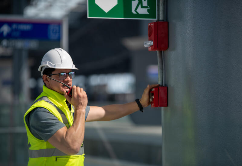 Engineer checking fire alarm