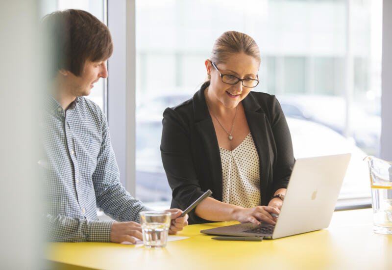 Man and woman having a meeting to discuss contact centre outsourcing