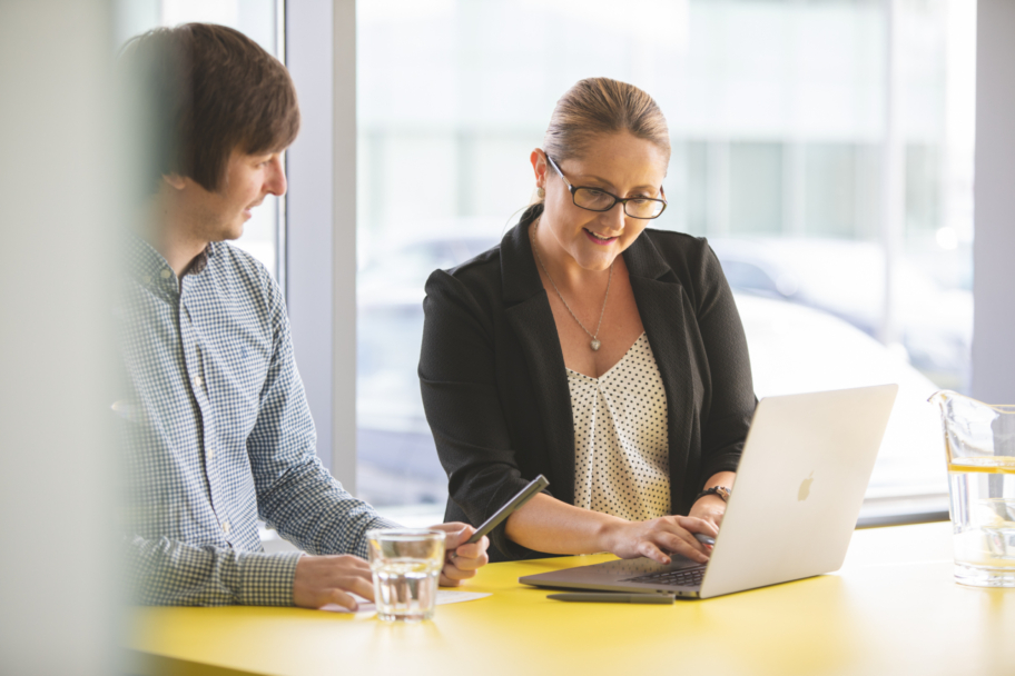 Man and woman having a meeting to discuss contact centre outsourcing